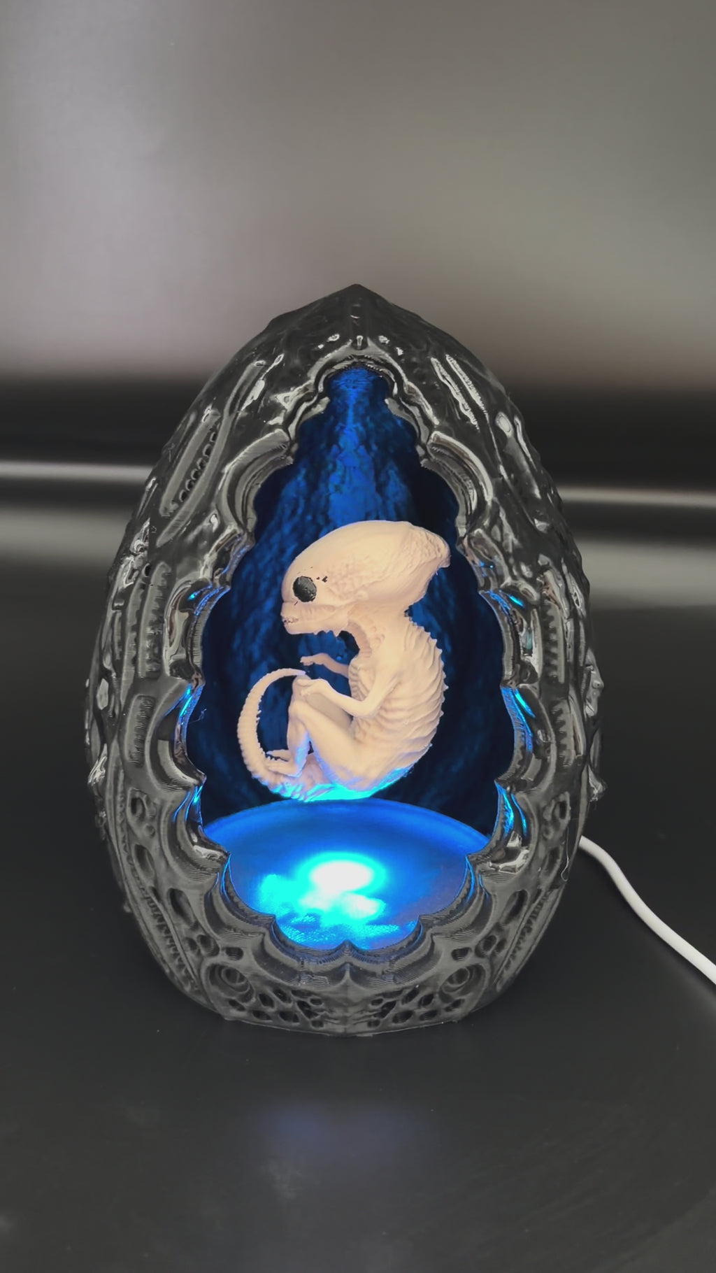 Video of the Shardlurker Specimen Night Light using push-button cable control with the fetal specimen illuminated inside the containment egg