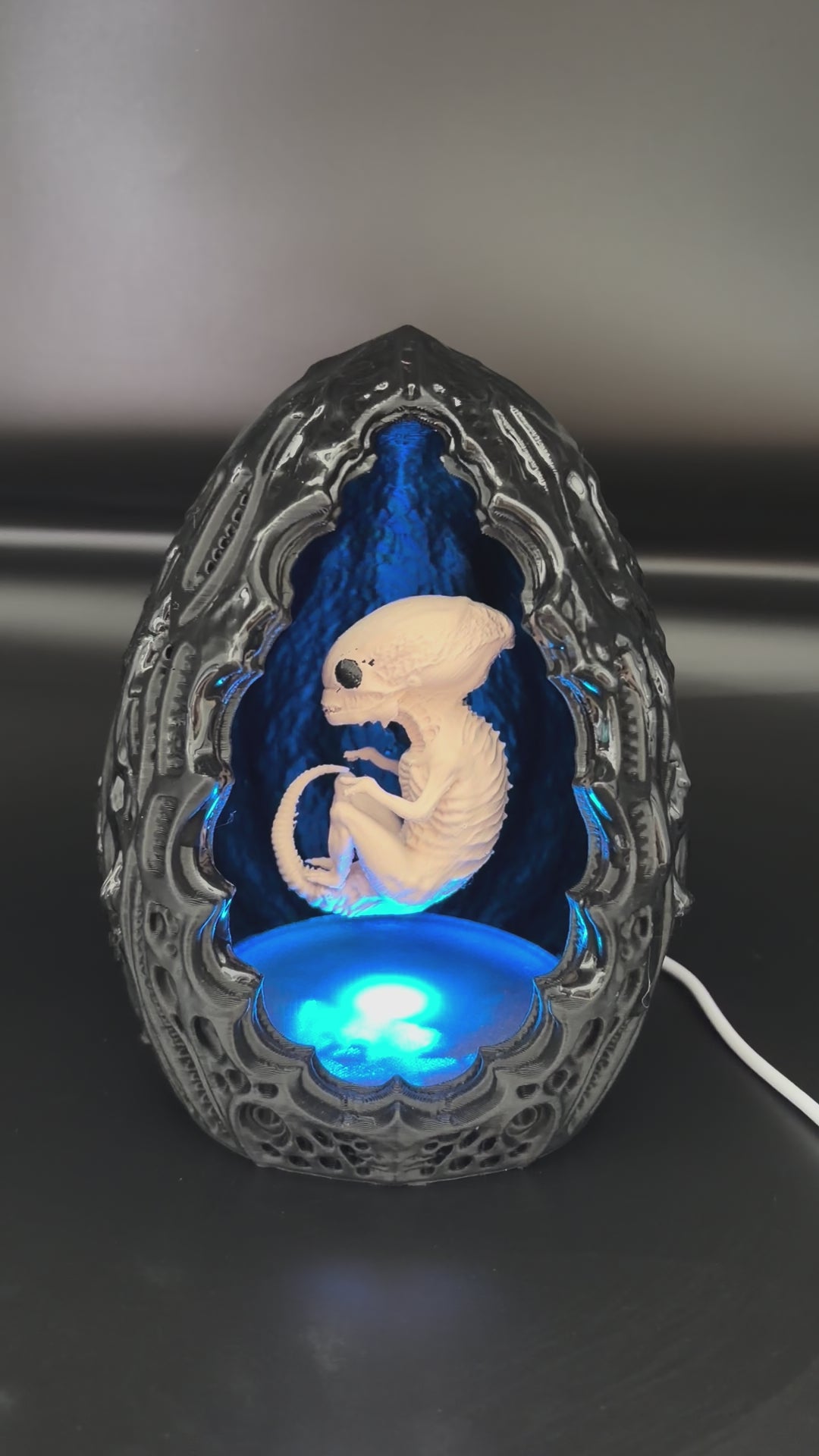 Video of the Shardlurker Specimen Night Light using push-button cable control with the fetal specimen illuminated inside the containment egg