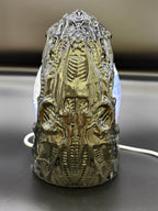 Right side view of the Shardlurker Specimen Night Light with the translucent blue resin egg and outer containment shell shown with the light off