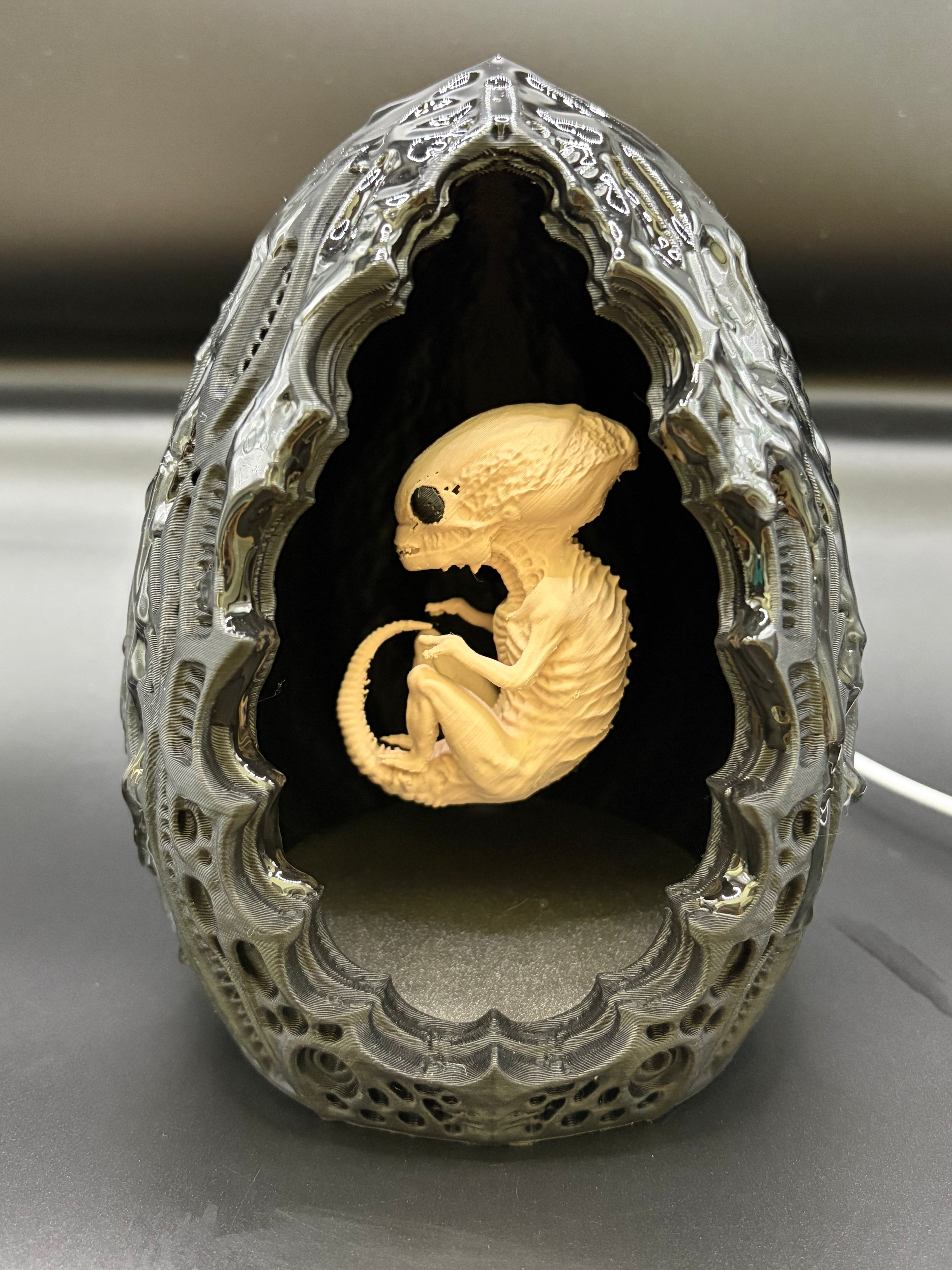 Shardlurker Specimen Night Light front view with glossy resin-finished containment egg and fetal specimen inside