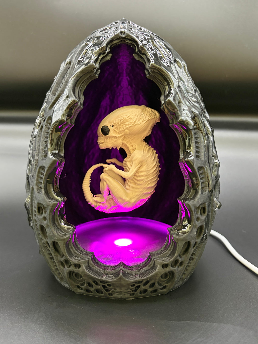 Shardlurker Specimen Night Light with glossy resin-finished containment egg illuminated in purple