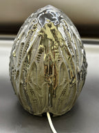 Rear view of Shardlurker Specimen Night Light showing glossy resin-finished containment egg and power cable