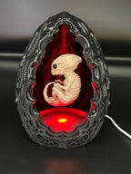 Shardlurker Specimen Night Light with glossy resin-finished containment egg illuminated in red