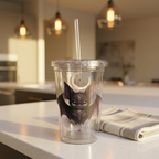 Vespertine Gothic Moon Bat 16oz acrylic tumbler with clear straw displayed on a kitchen counter, featuring a black bat, crescent moon, and celestial artwork