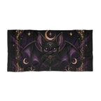 Vespertine Gothic Moon Bat beach towel featuring a black bat with purple wings, crescent moons, stars, and ornate gold celestial details