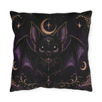 Vespertine Gothic Moon Bat outdoor throw pillow featuring a black bat with purple wings, crescent moons, stars, and ornate gold celestial details
