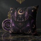 Vespertine Gothic Moon Bat outdoor throw pillow displayed on a dark marble surface beside a purple agate accent, featuring black bat and celestial artwork