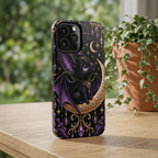 Vespertine Gothic Moon Bat phone case displayed upright on a table, featuring a black bat, crescent moon, purple crystals, stars, and ornate gold details