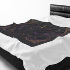 Vespertine Gothic Moon Bat velveteen plush blanket displayed on a bed with black and purple celestial artwork