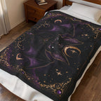 Vespertine Gothic Moon Bat velveteen plush blanket displayed on a bed in a bedroom with purple bat and celestial artwork