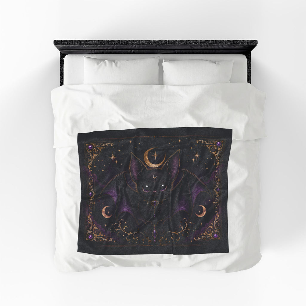 Vespertine Gothic Moon Bat velveteen plush blanket displayed flat on a bed with celestial bat artwork
